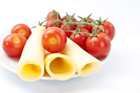 Cherry tomato with sliced cheeseの写真素材