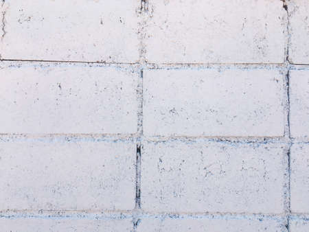 White brick wall texture with crack background for design. の写真素材