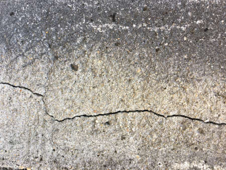 Cracked concrete wall texture with copy space for background. の写真素材