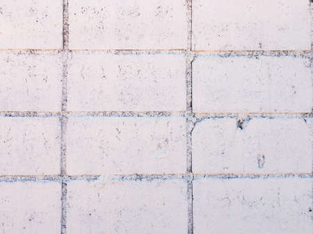 Vintage white brick wall texture with crack background for design. Home and office design backdrop with copy space.の写真素材