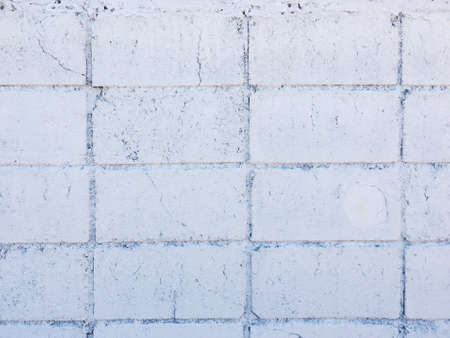 Vintage white brick wall texture with crack background for design. Home and office design backdrop with copy space.の写真素材