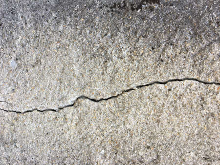 Cracked concrete wall texture with copy space for background. の写真素材