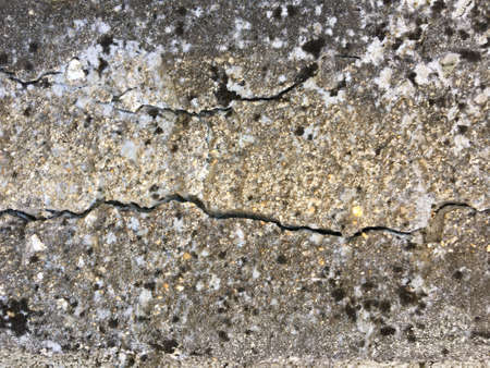 Cracked concrete wall texture with copy space for background. の写真素材