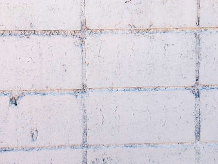 Vintage white brick wall texture with crack background for design. Home and office design backdrop with copy space.の写真素材