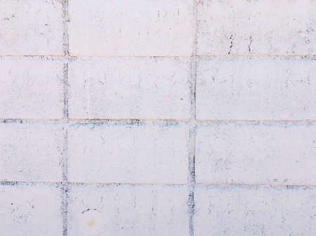 Vintage white brick wall texture with crack background for design. Home and office design backdrop with copy space.の写真素材