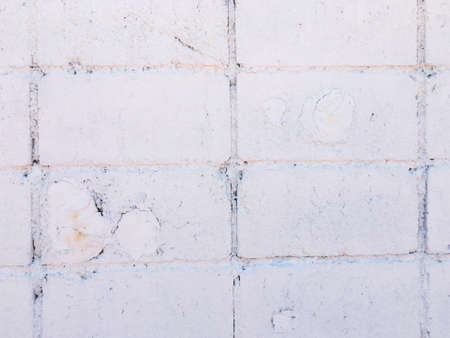 White brick wall texture with crack background for design. の写真素材