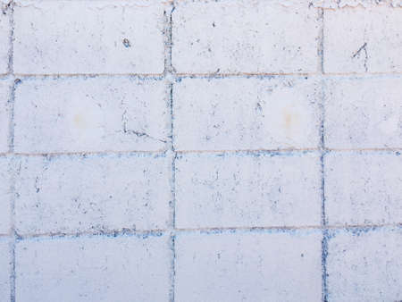 Vintage white brick wall texture with crack background for design. Home and office design backdrop with copy space.の写真素材