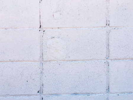 White brick wall texture with crack background for design. の写真素材