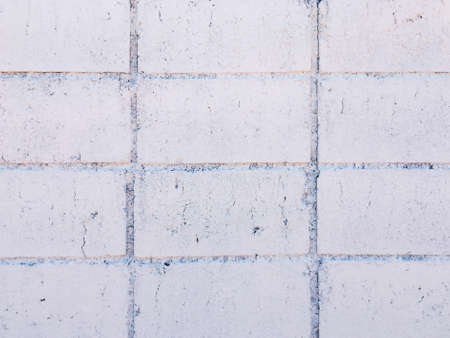 Vintage white brick wall texture with crack background for design. Home and office design backdrop with copy space.の写真素材