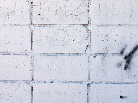 Vintage white brick wall texture with crack background for design. Home and office design backdrop with copy space.の写真素材