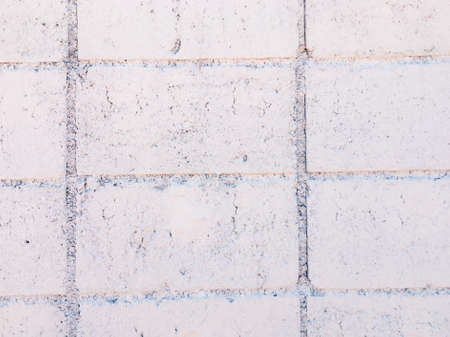 Vintage white brick wall texture with crack background for design. Home and office design backdrop with copy space.の写真素材