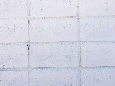 White brick wall texture with crack background for design. の写真素材