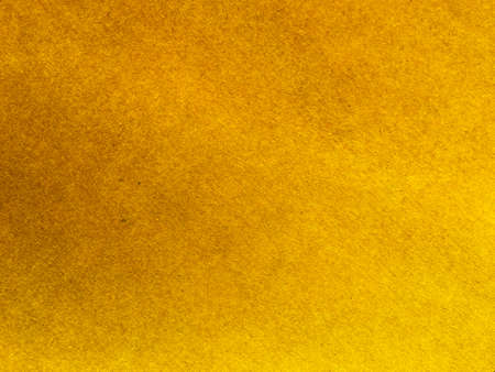 Yellow paper texture background for design. Wallpaper with copy spaceの写真素材