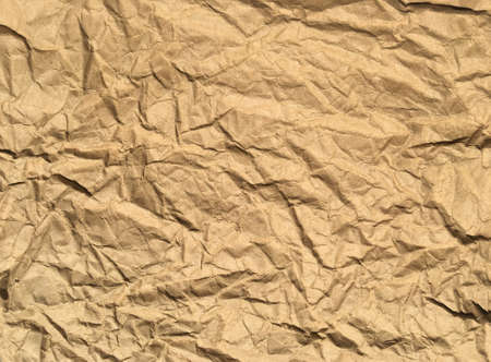 Brown wrinkle recycle paper background for Design. Blank  surface for text or workの写真素材