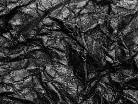 Black crumpled paper texture background. Copy space for design and artworkの写真素材
