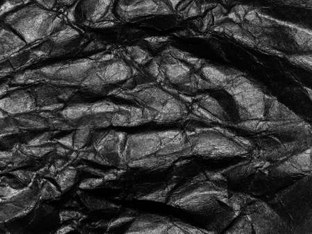 Black crumpled paper texture background. Copy space for design and artworkの写真素材