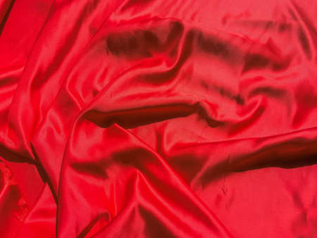 Red fabric texture for background with copy space. Valentines Day or Christmas Day wallpaper designの写真素材
