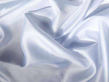 white crumpled fabric texture background. Silk curtain with fold waves for designの写真素材