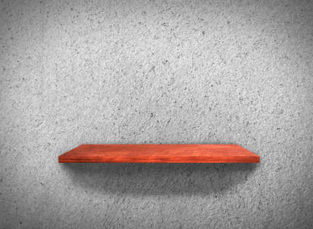 Top view of wood shelves on concrete wall texture backgroundの写真素材