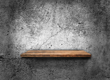 Blank of old wooden shelf on dark wall texture background  for designの写真素材