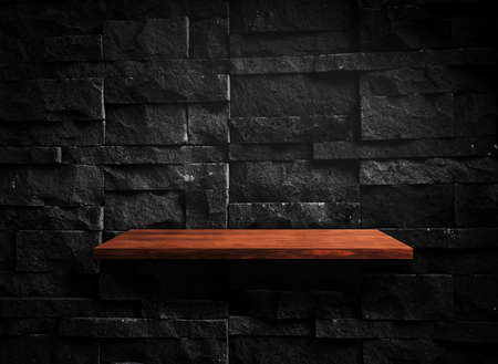 Wooden shelf on concrete wall texture backgroundの写真素材