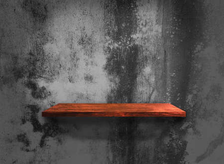 Wood shelves on concrete wall texture backgroundの写真素材