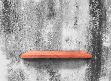 Wood shelves on concrete wall texture backgroundの写真素材