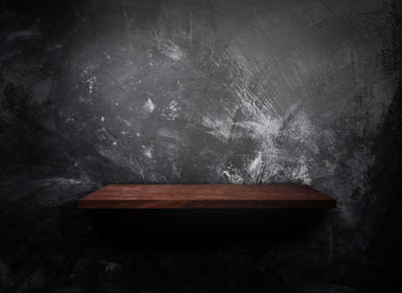 Wooden shelf on concrete wall texture backgroundの写真素材
