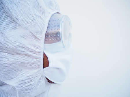 Side of face doctor or scientist in PPE suite uniform with copy space for text or design....
