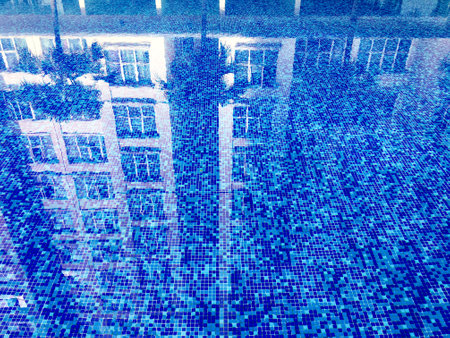 The abstract beauty of clean and clear water in a sparkling pool, creating a mesmerizing ripple pattern.の写真素材