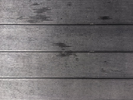 weathered and aged wooden backdrop creating a sense of history and character.の写真素材