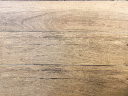 Empty wooden table top, providing a blank canvas for showcasing products or other elements.の写真素材