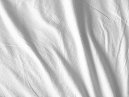 This image captures the essence of softness and purity with its white fabric background. copy space...