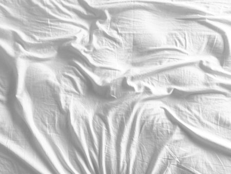 A visually stunning white cloth background, seamlessly woven to highlight its intricate pattern and smooth texture.の写真素材