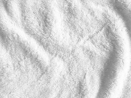 The soft and smooth surface of the cloth creates an abstract and luxurious backdrop, perfect for a sophisticated design.の写真素材