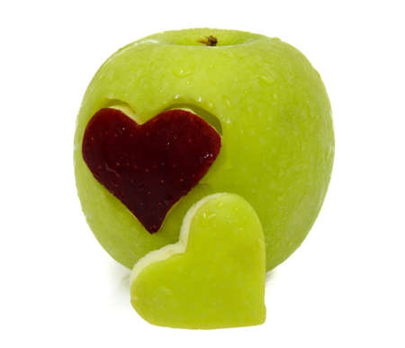Red and Green Apple in heart shapeの写真素材
