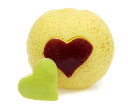 Red and Green Apple in heart shapeの写真素材