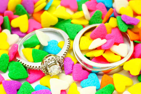 Wedding Ring with colorful heart shape backgroundの写真素材