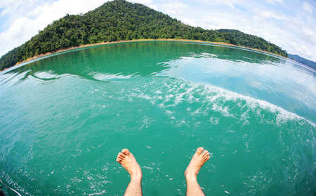 Crystal clear water tumbles down a tropical lake in Tasik Kenyir, Terengganu, Malaysia                  の写真素材