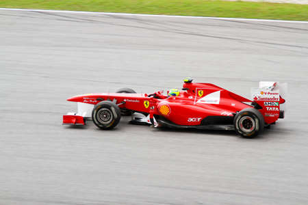 SEPANG, MALAYSIA - APRIL 8: Ferrari's driver Felipe Massa races down the track on practice day at the 2011 Petronas Malaysia Grand-Prix on April 8, 2011 in Sepang International Circuit, Malaysiaのeditorial素材
