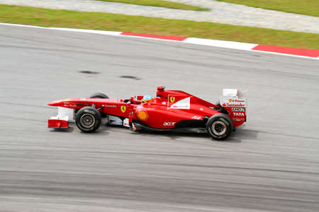 SEPANG, MALAYSIA - APRIL 8: Ferrari's driver Fernando Alonso races down the track on practice day at the 2011 Petronas Malaysia Grand-Prix on April 8, 2011 in Sepang International Circuit, Malaysia. のeditorial素材