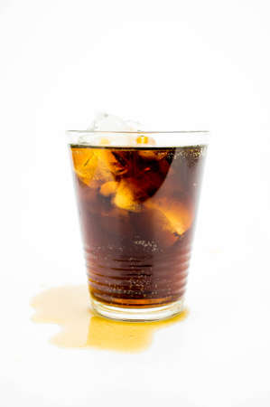 Glass of Coke (Cola) with ice cubes on white backgroundの写真素材