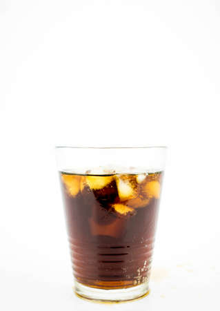 Glass of Coke (Cola) with ice cubes on white backgroundの写真素材