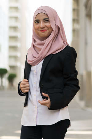 Beautiful Malay girl outdoor wearing executive suitの写真素材