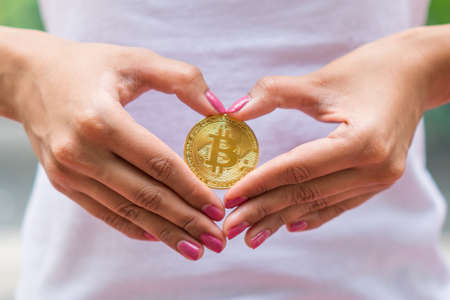 Selective Focus of hand holding Bitcoin Moneyの写真素材