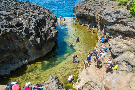 BALI, INDONESIA - MARCH 24, 2018: Tourist at billabong beach , Nusa Penida, Indonesiaのeditorial素材