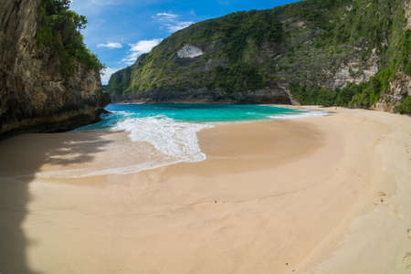 Crystal Clear water at Manta Bay or Kelingking Beach on Nusa Penida Island, Bali, Indonesia