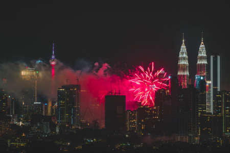 KUALA LUMPUR, MALAYSIA - JANUARY 1, 2019: Colorful Fireworks spark during new year at the Petronas Twin Tower (KLCC)のeditorial素材