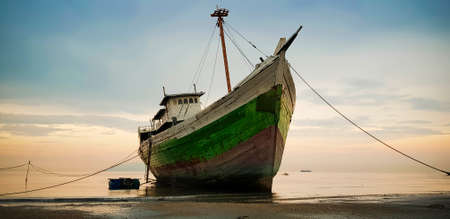 DILI, EAST TIMOR - DECEMBER 6, 2018: Large fisherman ship was anchored on the beach at Dili East Timorのeditorial素材