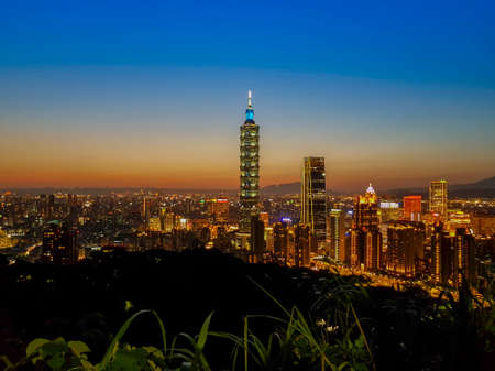 TAIPEI, TAIWAN - MAY 3, 2019: Taipei cityscape during sunset blue hours with foregroundのeditorial素材